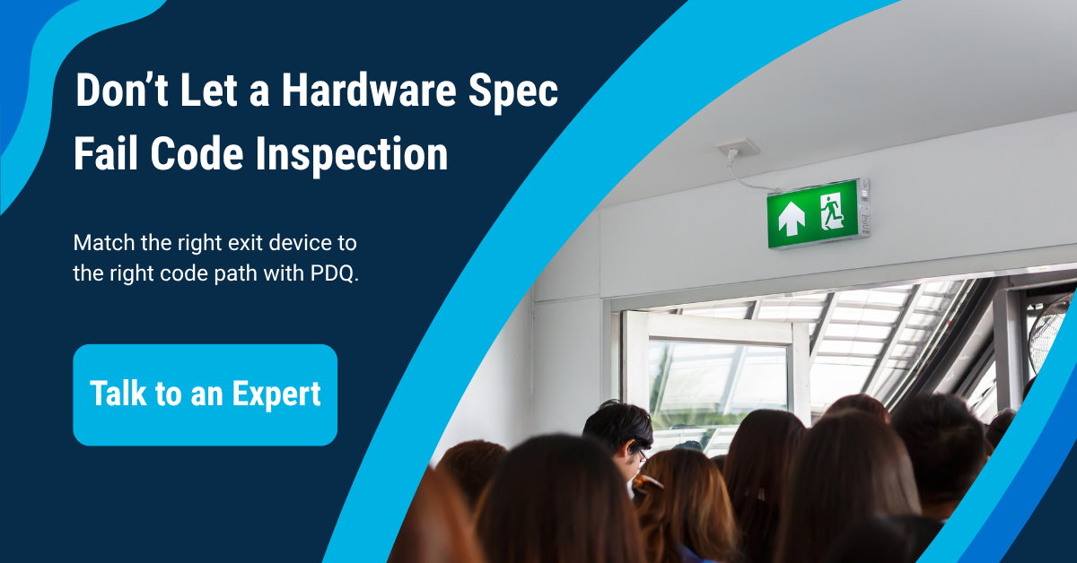 PDQ promotional banner reading 'Don't Let a Hardware Spec Fail Code Inspection' with a photo of a crowd exiting through a doorway under an illuminated exit sign, and a 'Talk to an Expert' call-to-action button.