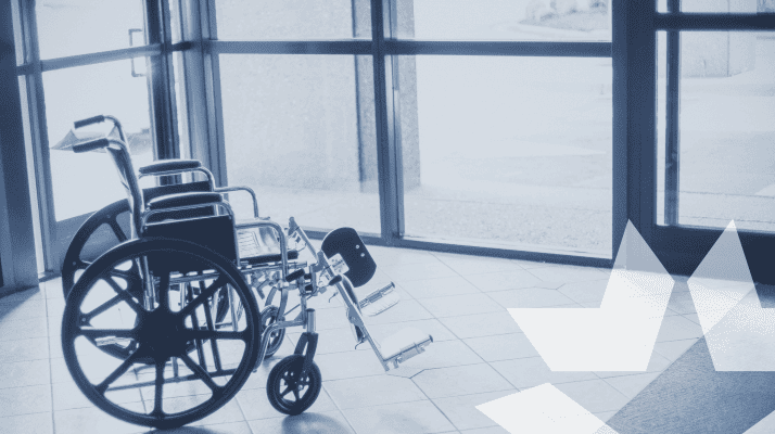 Wheelchair by door to show the door hardware is ADA complaint