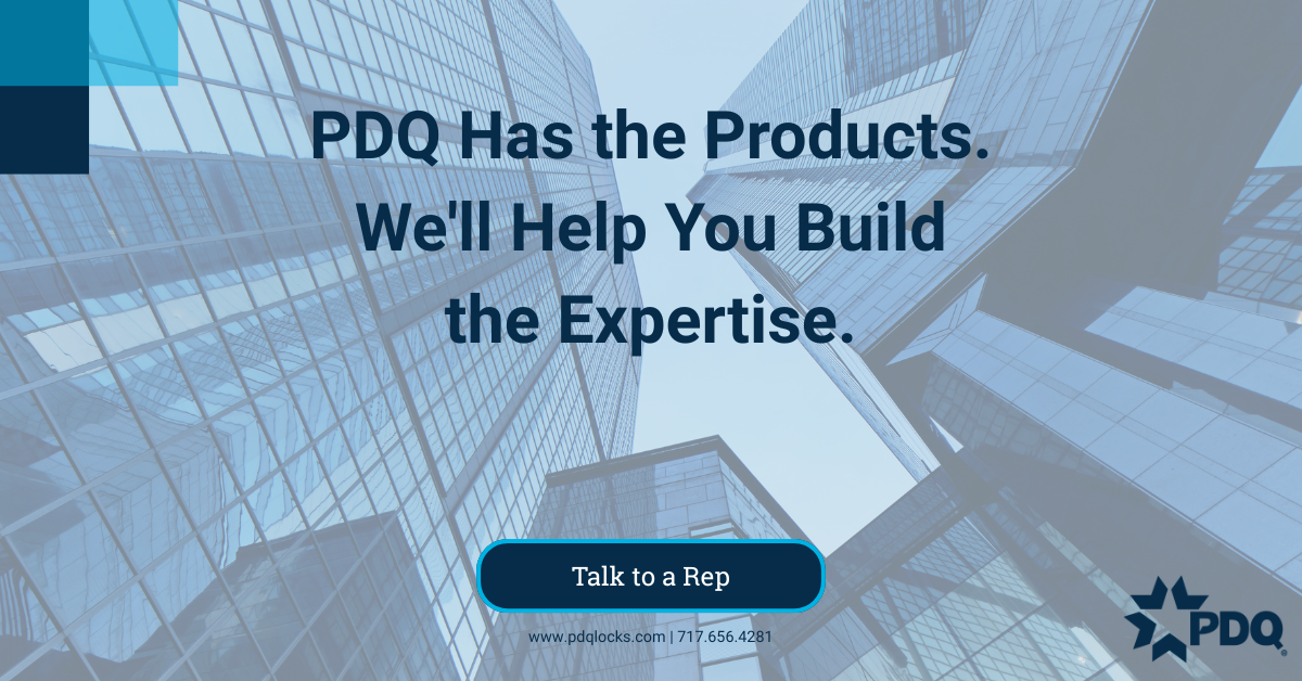 PDQ branded graphic with the headline "PDQ Has the Products. We'll Help You Build the Expertise." over a blue-tinted upward view of glass office buildings, with a More Products button linking to pdqlocks.com.